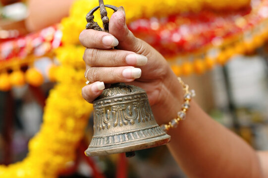 Bell ringing to worship Goddess Uma Devi Temple Silom Rd., Bangkok, Thailand