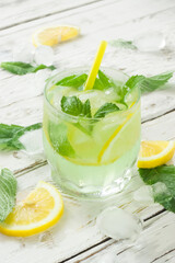 Mojito cocktail with lime and mint. Vertical photo.