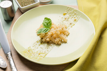 Plate with tasty pasta on table, closeup