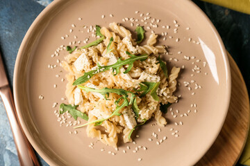 Plate with tasty pasta on table, closeup