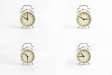 Close-up of a group of white retro watches on a white background showing the time 10:00, 10:15, 10:30, 10:45, 22:00, 22:15, 22:30, 22:45, ten in the morning, ten in the evening, ten and a quarter