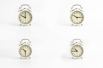 Close-up of a group of white retro watches on a white background showing the time 10:00, 10:15,...