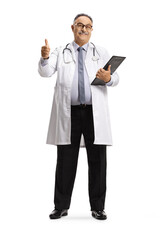 Full length portrait of a cheerful mature male doctor showing thumbs up