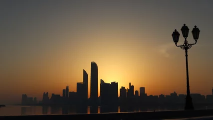 Zelfklevend Fotobehang Abu Dhabi city Street light at sunrise © Baskaran