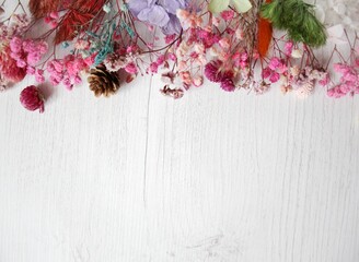 Dried flowers on rustic wooden planks background