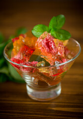 colored sweet fruit jelly in a glass glass