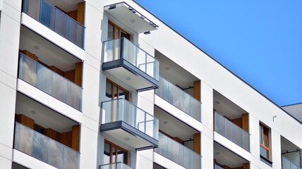 Fragment of modern luxury residential apartment,  home house building concept. Modern apartment building on a sunny day with a blue sky.
