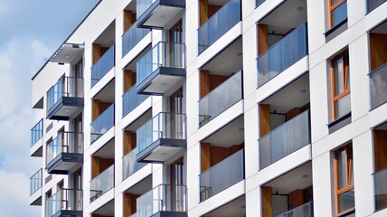 Fragment of modern luxury residential apartment,  home house building concept. Modern apartment building on a sunny day with a blue sky.
