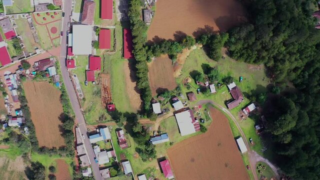 Aerial view of houses and harvest fields in the village