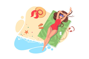 Girl get tan in swimsuit on beach