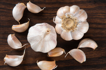 Garlic Cloves and Bulb isolated on wooden background.