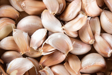 Background with various Garlic Cloves close up.