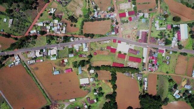 Aerial view of houses and harvest fields in the village