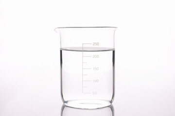 Sterilized water is poured into measuring glass closeup