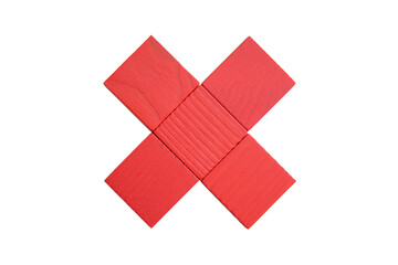 Red figure x isolated on white background. The figure is made of square parts of a children's wooden construction set in the shape of the letter X.  Symbol of rejection, denial and collapse.