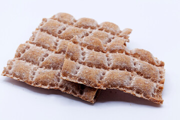 crumbled hard bread on white background