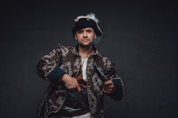 Elegant pirate with boarding pistols and serious face