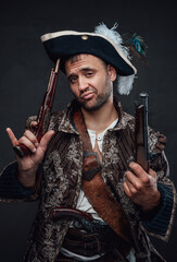 Fototapeta premium Pirate bandit with handguns and smug face