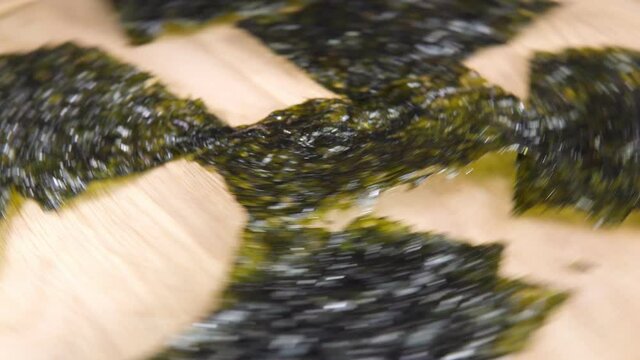 Japanese food nori dry seaweed or edible seaweed close-up. Rotate