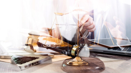 Business and lawyers discussing contract papers with brass scale on desk in office. Law, legal services, advice, justice and law concept picture with film grain effect