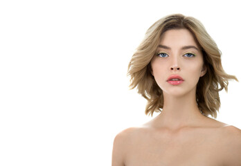 Fototapeta premium Beautiful young woman with perfect skin and wavy hair. Fashion model with nice professional make-up posing in the studio, isolated on white.