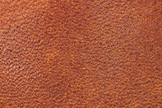 Brown genuine leather texture background high resolution close-up photo