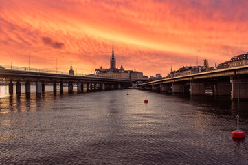 Fototapeta na wymiar Church of Santa Clara. Sunset with a bright red sky. Stockholm, Sweden
