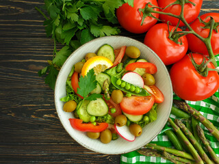 cucumber salad, tomato, green peas, olives
