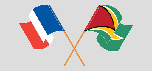 Crossed and waving flags of France and Guyana