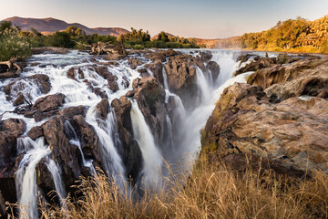 Epupa falls, Namibian side, Angola border.  Multiple rivulets and cascading waters in soft evening light