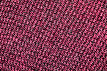 Red fabric texture of natural cotton or linen textile material, warm red sweater cloth close-up, high resolution background