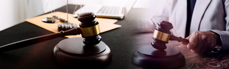 Business and lawyers discussing contract papers with brass scale on desk in office. Law, legal...