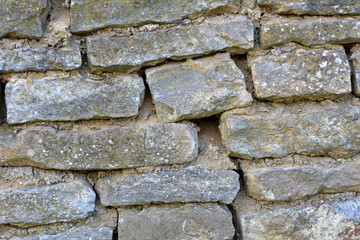 Old wall built of natural stone