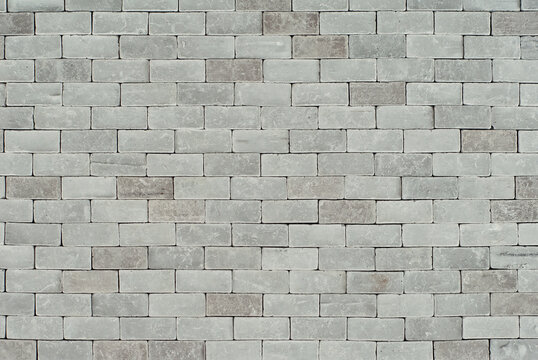 Gray bricks close up. Texture of concrete wall. Fence made of concrete blocks.