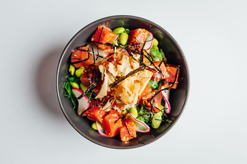 Organic Poke bowl with Tuna and veggies on white background