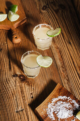 Margarita cocktail in drinking glasses with salt rim