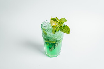 Fresh mojito cocktail in glasses on bright background with lime ant mint lefs, alcoholic cocktail.