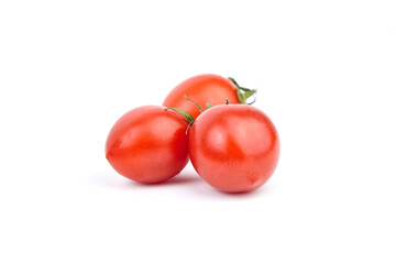 Red tomatoes isolated on white background. Three fresh tomatoes