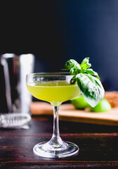 Thai Basil Gimlet Cocktail with Garnish: A gin cocktail in a coupe glass