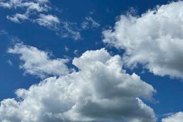 Naklejka na ściany i meble White a cumulus clouds and a blue sky