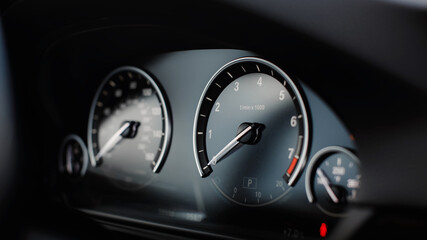 Modern car miles Speedometer close up.