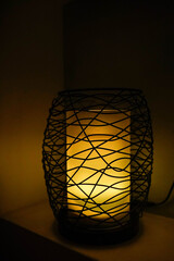Fototapeta na wymiar Iluminated desk lamp, warm light