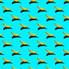 pattern with ripe yellow banana isolated on a bright blue background. hard shadows from the sun at noon