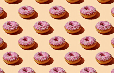Pattern of donuts on yellow background