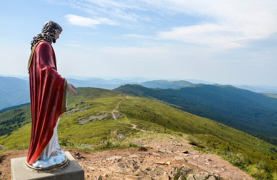 View of sculpture of Jesus Christ on the top of the Pikuj mountain peak. Carpathian Mountains, Ukraine