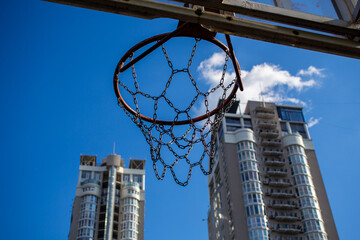 Basketball backboard with a ring on the street on the playground