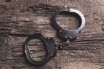 handcuffs on a wooden table