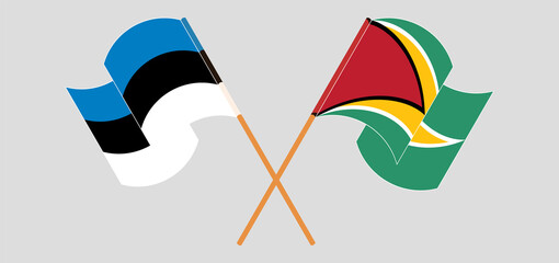 Crossed and waving flags of Estonia and Guyana