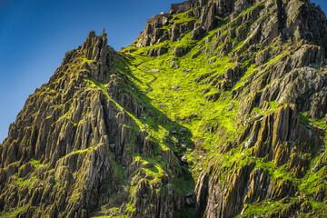 Closeup on steep stairs or ladder carved in stone on Skellig Michael island where Star Wars were...