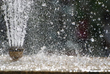 A stopped movement of fountain droplets in middle of air. 